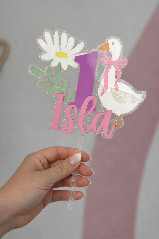 Cake topper with sparkle acrylic, pastel colours and goose design